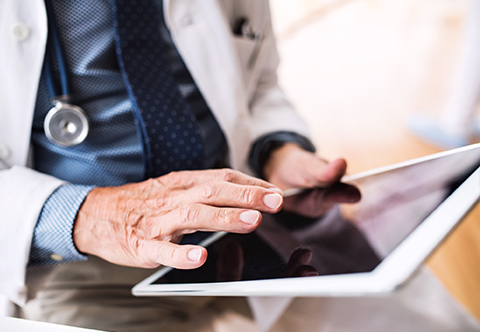 Physician using a tablet